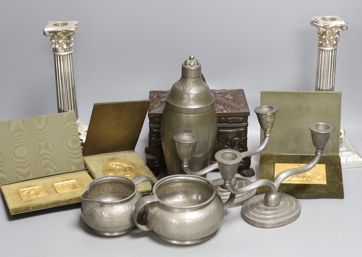 A German Babcock Werke cigarette box, together with mixed pewter, a pair of plated candlesticks and three religious relief plaques